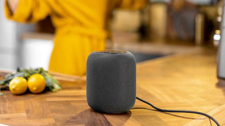 woman-distracted-by-phone-in-kitchen