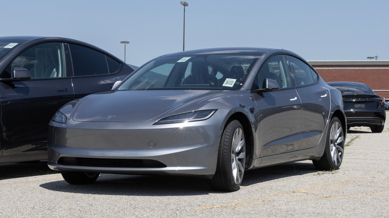 2025 Tesla Model 3 displayed at a dealership.