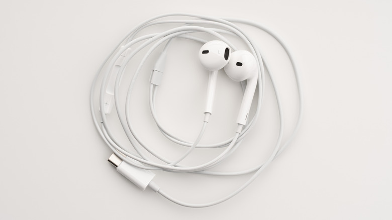 A pair of wired white USB-C Apple EarPods on a white background.