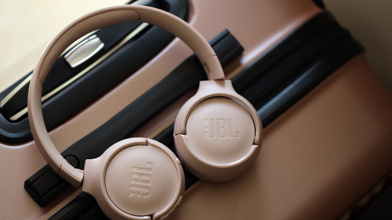 JBL Tune 500 headphones on a travelling suitcase