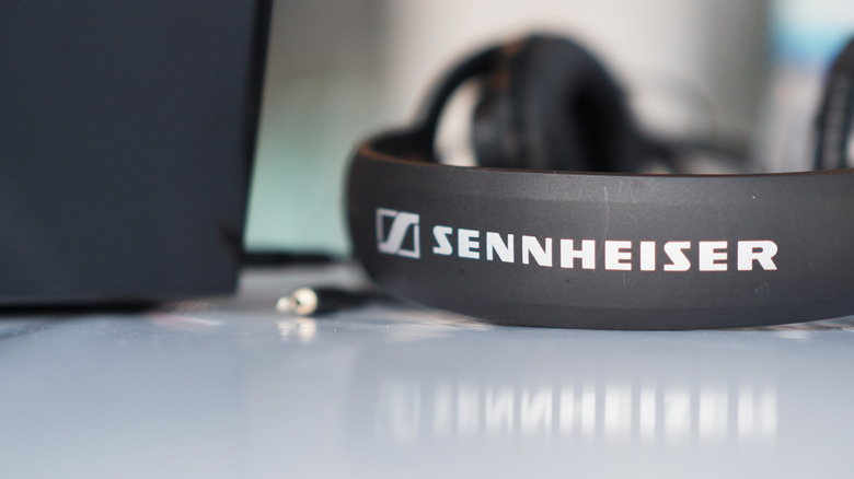 A pair of Sennheiser over-ear headphones lying on a table