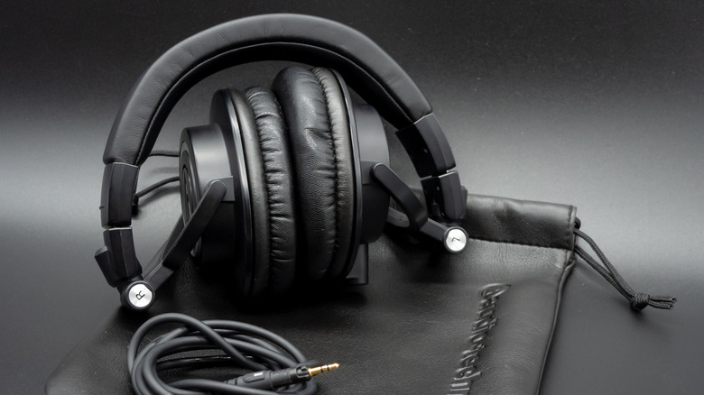 A pair of audio-technica folded up on a desk