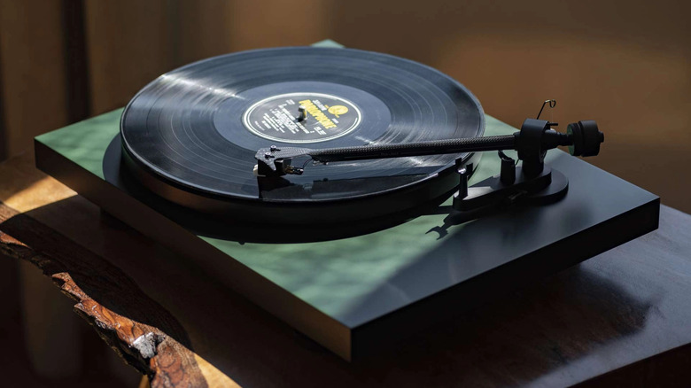 A dark green Pro-Ject Debut Carbon Evo