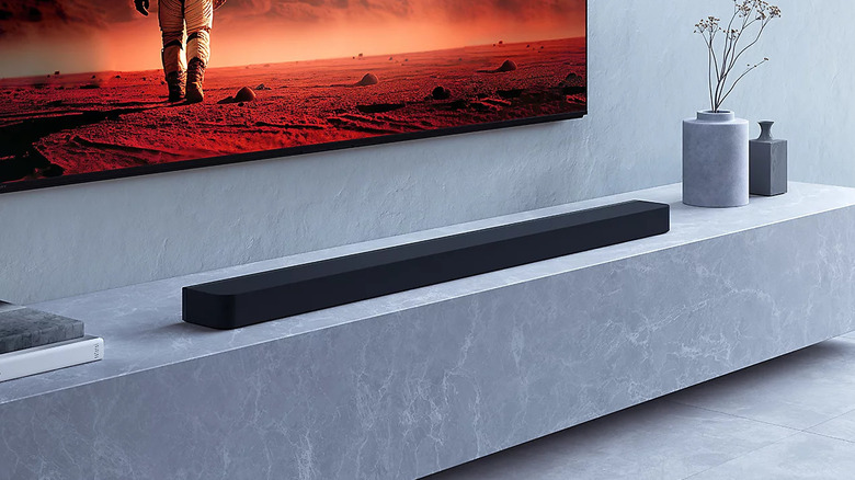 The Sony Bravia Theatre Bar 9 soundbar placed under a TV in a modern home.