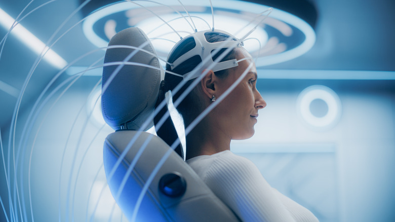 Woman wearing headset in futuristic laboratory