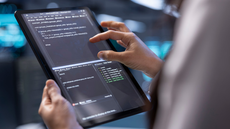 Person holding a tablet device