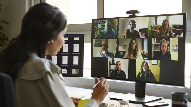 Businesswoman talking with people on video call
