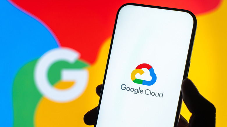 Showing Google Cloud on a phone in front of the Google logo