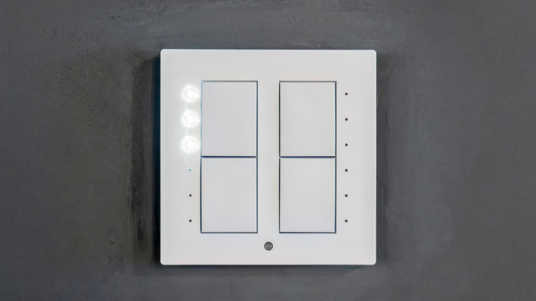 A person using a switch in their home