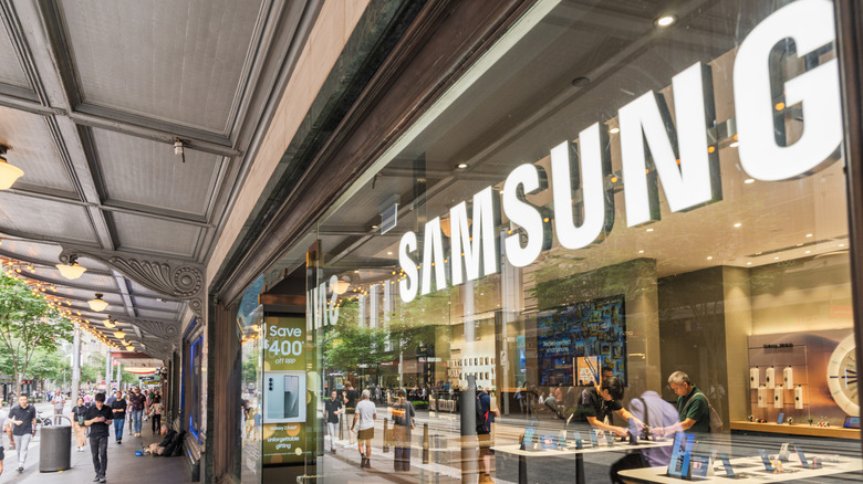 The Samsung logo on the facade of a physical store.