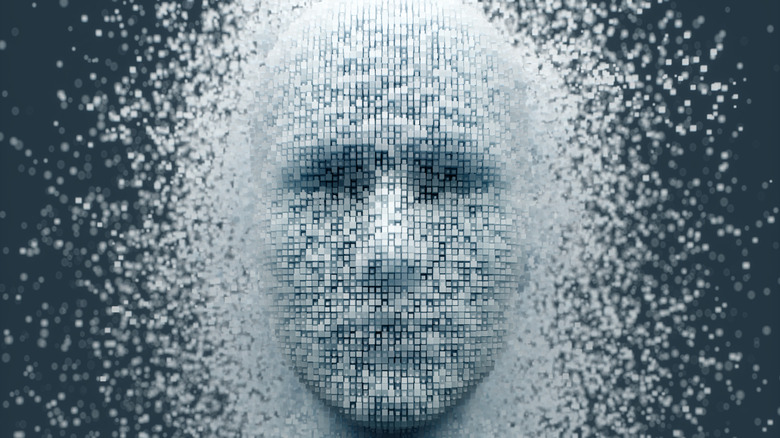 A rendering of a human head made from tiny 3D particles is dissolving.