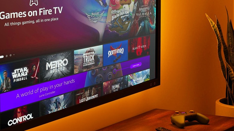 Amazon Fire TV mounted on wall displaying video games