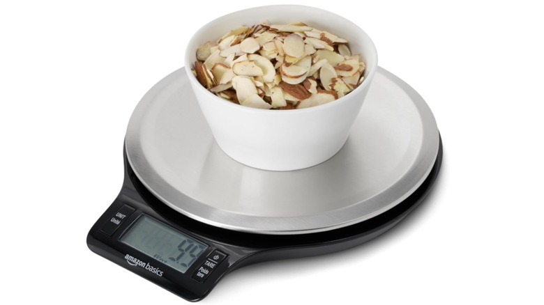 The Amazon Basics Digital Kitchen Scale with a bowl on top