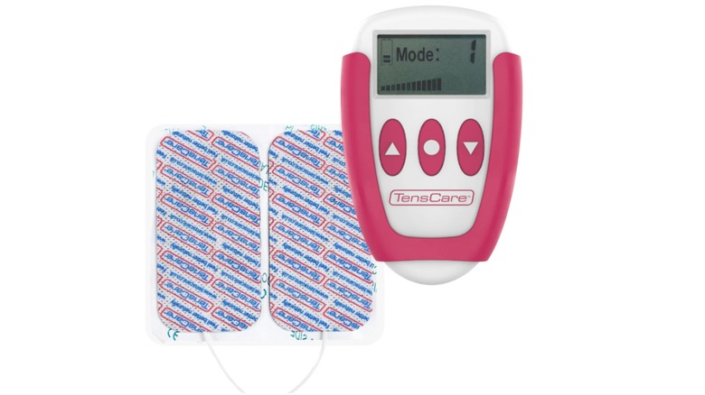 A TensCare OVA+ device in pink and white