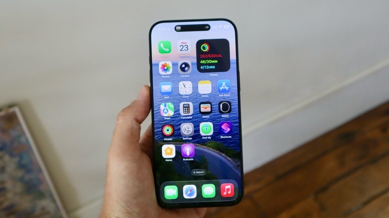 iPhone Home Screen on iOS 26 highlighting several stock apps, including the Phone app