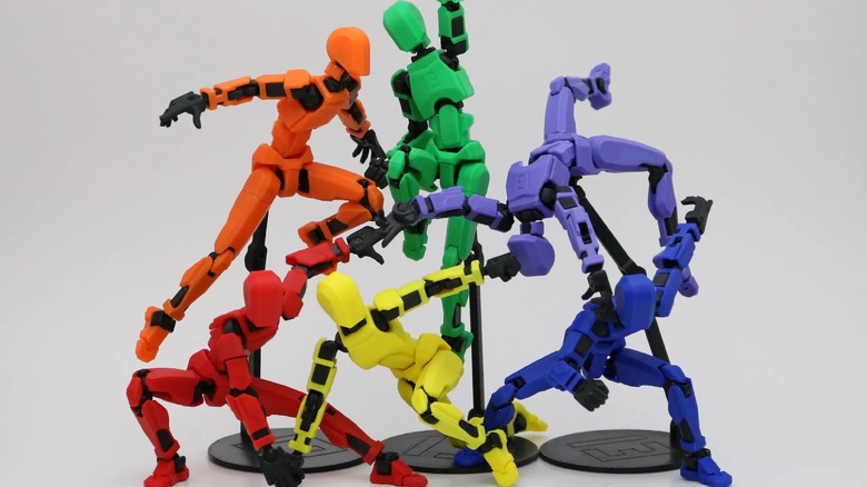 Rainbow colored set of 3D printed posable robot models