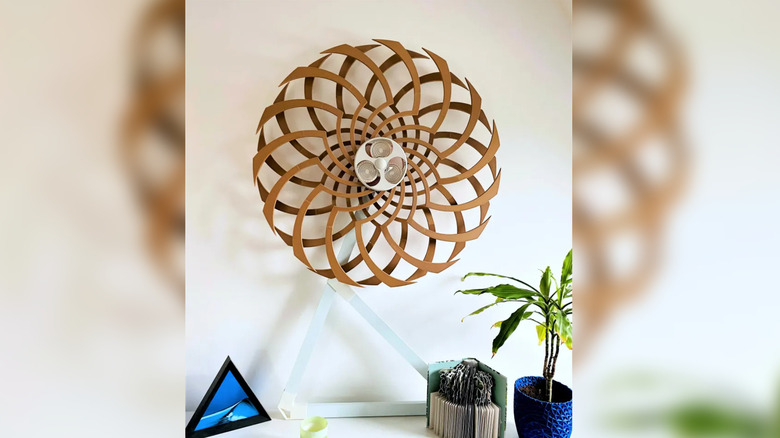 A rotating kinetic sculpture on a desktop