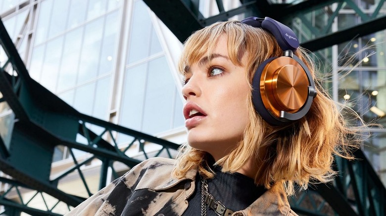 A woman wearing the Dyson OnTrac headphones