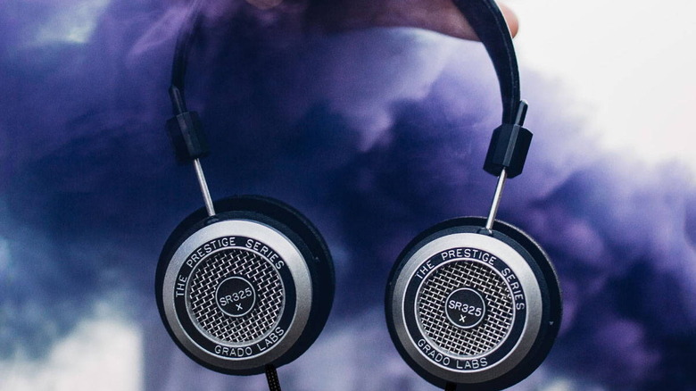 Someone holding the Grado SR325x