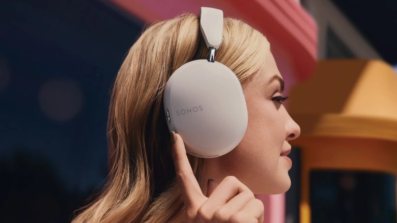 A woman showcasing the Sonos Ace