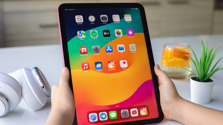 Hands holding an iPad
