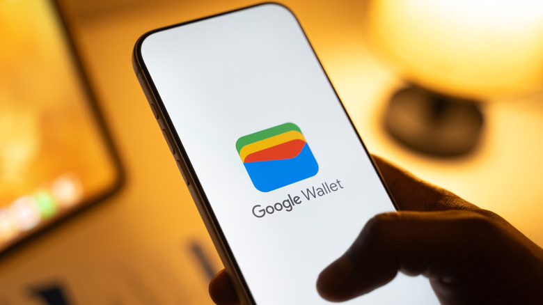 The Google wallet logo displayed on the screen of a smartphone