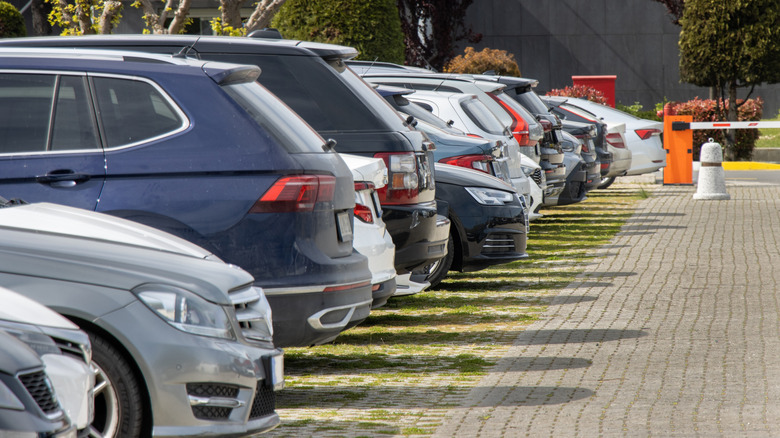 Multiple cars parked in a parking lot
