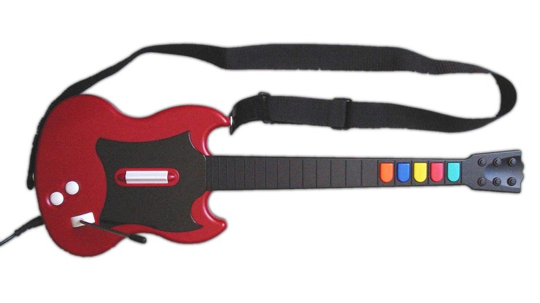 The red Guitar Hero SG Controller on a white background