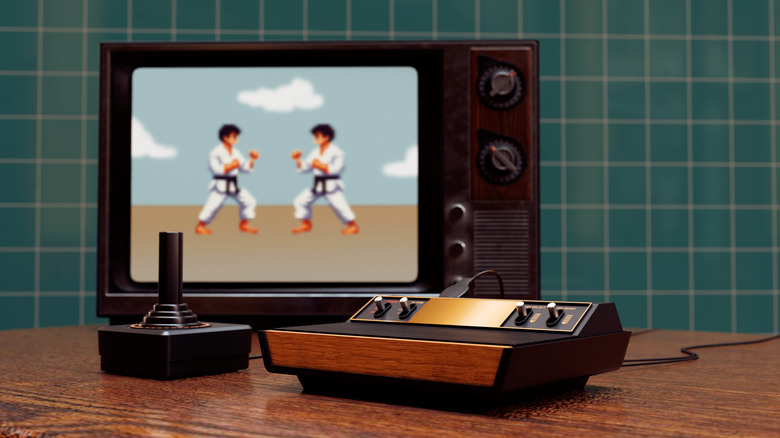 A game running on a CRT with a retro console and joystick