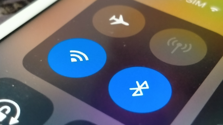 The Bluetooth icon on a phone screen.