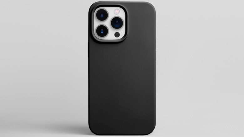 An iPhone with a protective case.