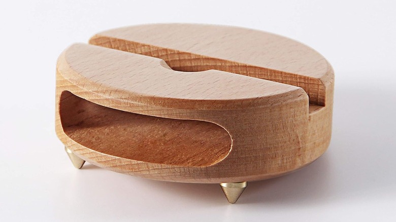 A wooden passive phone amplifier stand.