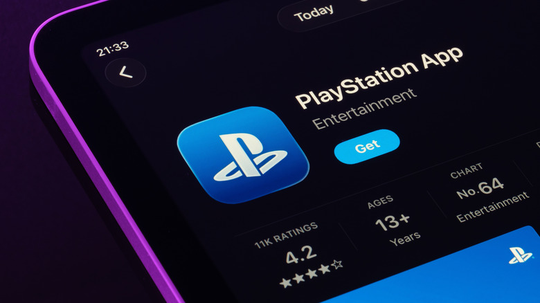 Close-up shot of the PlayStation App download page on the App Store in dark mode