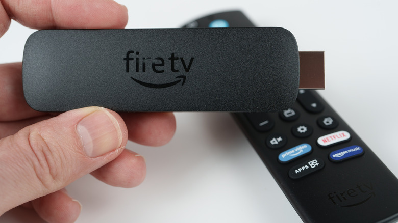 Holding the Fire TV Stick in hand