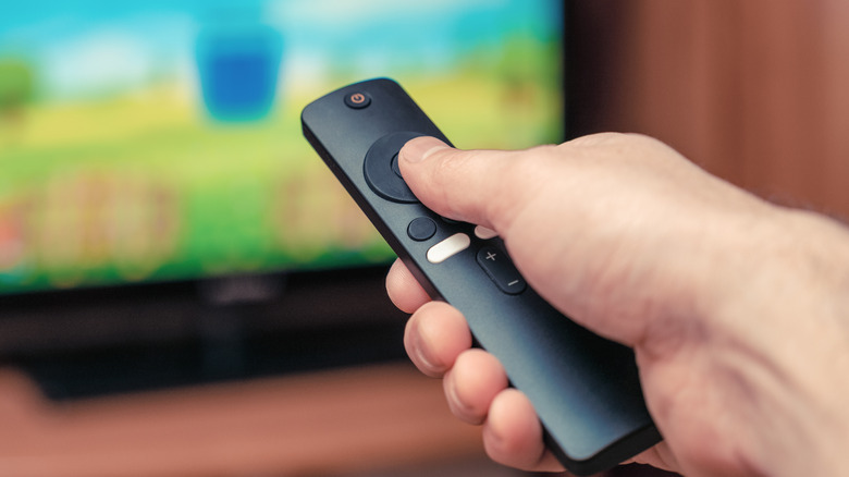 Watching TV with the Fire TV remote in hand