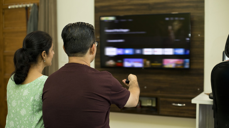 Couple watching television while using the Fire TV Stick