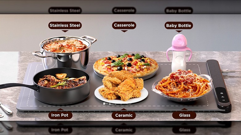 Different types of food containers placed on a warming mat