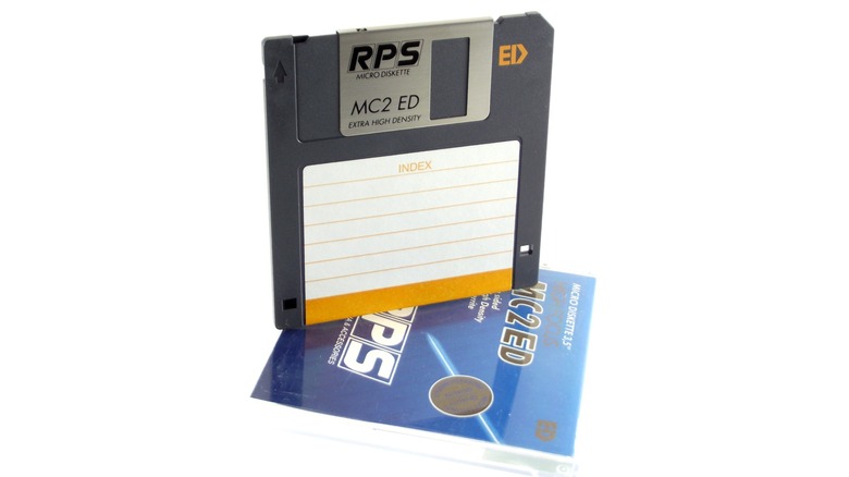 An extended density floppy with its case isolated on a white background.