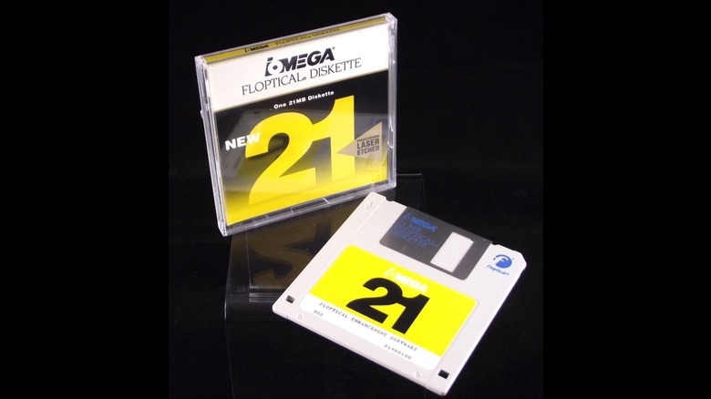 An Insite Floptical disk with its cover isolated on a black background.
