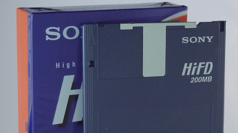 A Sony HiFD disk next to a case of more disks.