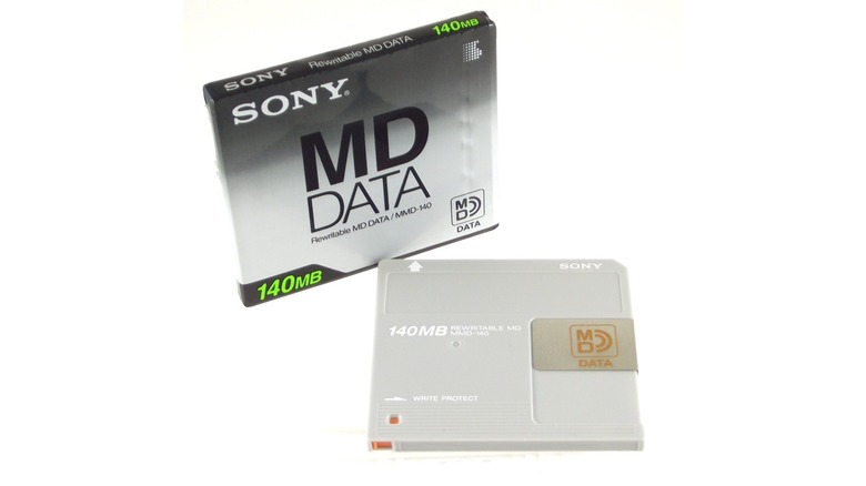 A Sony MD Data disk next to its cover isolated on a white background.