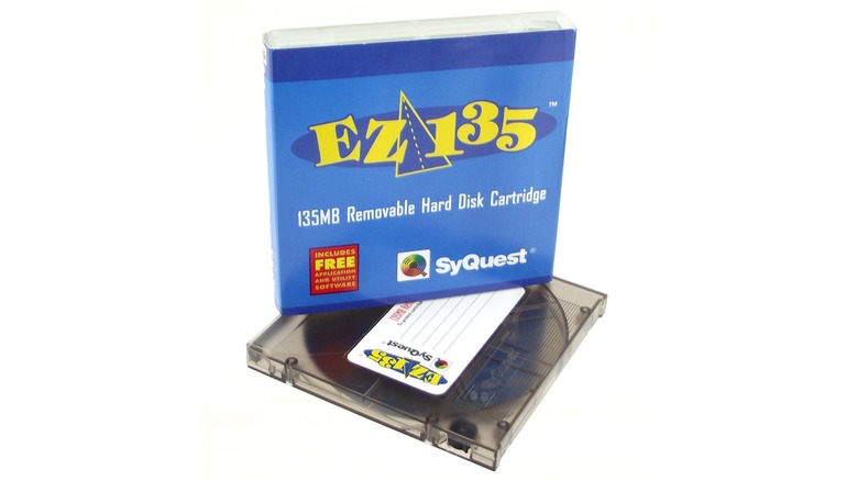 A blue SyQuest EZ135 case on top of its disk isolated on a white background.