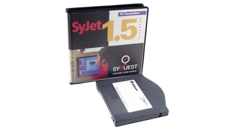 A SyJet 1.5GB case next to its disk isolated on a white background.