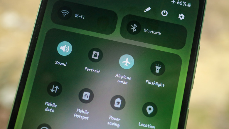 Smartphone screen view with quick settings menu.