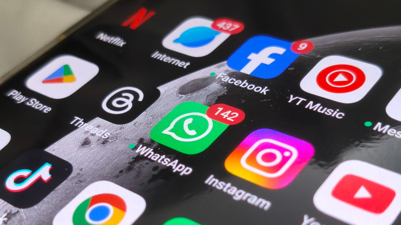 Mobile device screen with popular social networks and chat apps