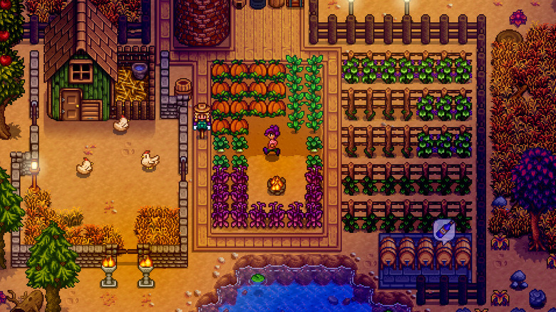 Top-down view of a farmer tending crops and animals on a colorful farm in Stardew Valley.