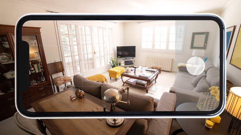 Phone screen superimposed over a living room ready to take a picture