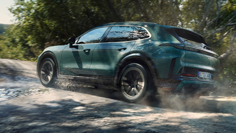 Porche Cayenne Electric driving on a gravel track