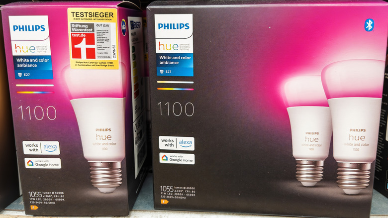 Philips Hue White and Color Ambiance LED Bulbs boxes next to each other