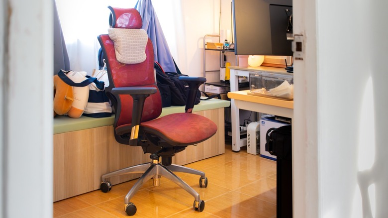 the author's ergonomic mesh chair inside his home office